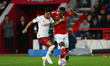 Amad Diallo of Manchester United is battling with Taiwo Awoniyi of Nottingham Forest durin...