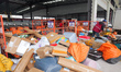 Staff members are sorting deliveries at Daodjia Express Co LTD in Enshi Prefecture, Centra...