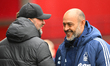 Jurgen Klopp, the manager of Liverpool, and Nuno Espirito Santo, the head coach of Notting...