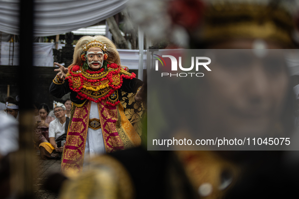 Tari Topeng, or Mask Dance, is being performed before a cleansing ceremony called 'Melasti' at Segara Temple in Jakarta, Indonesia, on March...