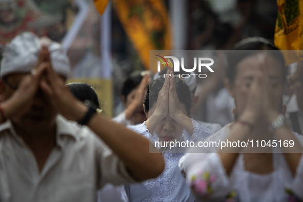 Indonesian Hindus are praying during a cleansing ceremony called 'Melasti' at Segara Temple in Jakarta, Indonesia, on March 3, 2024. They be...