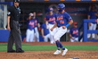 Rylan Bannon, #58 of the New York Mets, is crossing home plate to score during the fifth i...