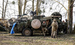 Servicemen present armed vehicles during NATO's  Dragon-24 exercise, a part of large scale...