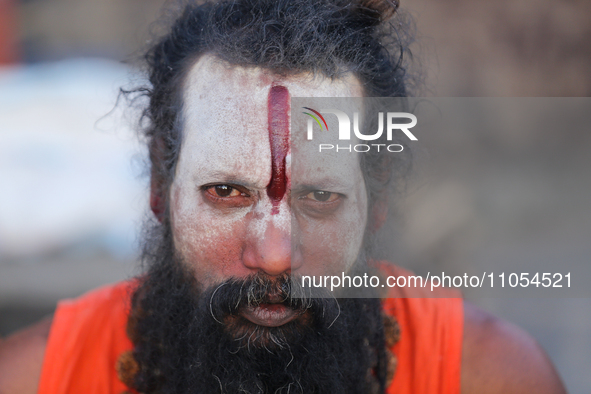 A Sadhu, or Hindu Saint, is being pictured on the eve of Maha Shivaratri at the Pashupatinath Temple premises in Kathmandu, Nepal, on March...