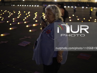 Irinea Buendia, the mother of a femicide victim, is protesting in the Zocalo of Mexico City, during an evening before the International Wome...