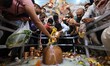 Devotees are performing 'abhishek' of Hindu Lord Shiva at the Jharkhand Mahadev temple on...