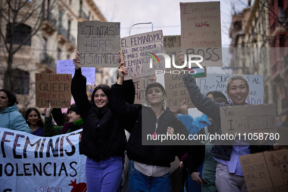 Protesters are holding banners and shouting slogans during the International Women's Day demonstration in Granada, Spain, on March 8, 2024....