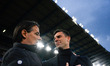 Head Coach Simone Inzaghi of FC Inter and Head Coach Thiago Motta of Bologna FC are watchi...