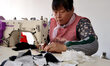 A worker is producing toys for export at a workshop of a toy company in Binzhou, Shandong...
