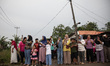 Residents are watching as Balinese Hindus parade the Ogoh-ogoh during the Tawur Kesanga ri...