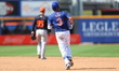 New York Mets' Tomas Nido #3 is rounding the bases after hitting a home run during the nin...