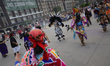 Members of various pre-Hispanic dance groups are participating in an offering and a massiv...