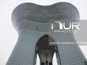A photo taken on March 3, 2024, shows the Urumqi Cultural Center, which is a complex that includes a grand theater, concert hall, book mall,...