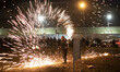 An Iranian man is performing with fire while participating in the annual ''Chahar Shanbeh...