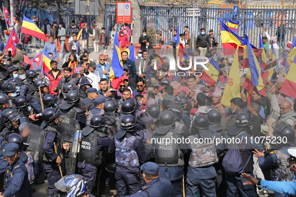 Nepal Police are baton-charging pro-monarchy supporters as they try to disrupt traffic during a protest march in Kathmandu, Nepal, on March...