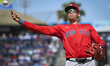 Boston Red Sox first baseman Triston Casas (36) is throwing to first base against the Phil...
