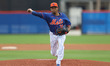 New York Mets relief pitcher Edwin Diaz is pitching during a spring training baseball game...