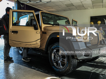 The 4X4 Thar Earth Edition is being showcased in a new golden color at a Mahindra showroom in Srinagar, Jammu and Kashmir, India, on March 1...