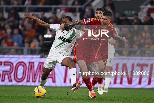 Armand Lauriente of U.S. Sassuolo and Gianluca Mancini of A.S. Roma are competing during the 29th day of the Serie A Championship between A....