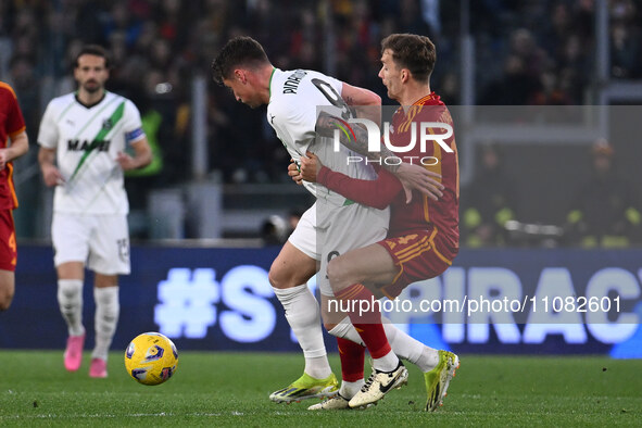 Andrea Pinamonti of U.S. Sassuolo and Diego Llorente of A.S. Roma are competing during the 29th day of the Serie A Championship between A.S....