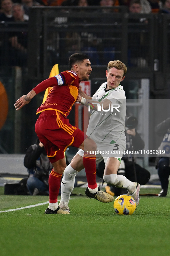 Lorenzo Pellegrini of A.S. Roma is competing against Marcus Holmgren Pedersen of U.S. Sassuolo during the 29th day of the Serie A Championsh...