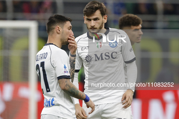 Matteo Politano of Napoli is talking with Khvicha Kvaratskhelia of Napoli during the Serie A soccer match between Inter FC and SSC Napoli at...