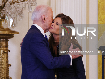 President Joe Biden is embracing activist Maria Shriver at an event at the White House in Washington DC, on March 18, 2024, celebrating Wome...