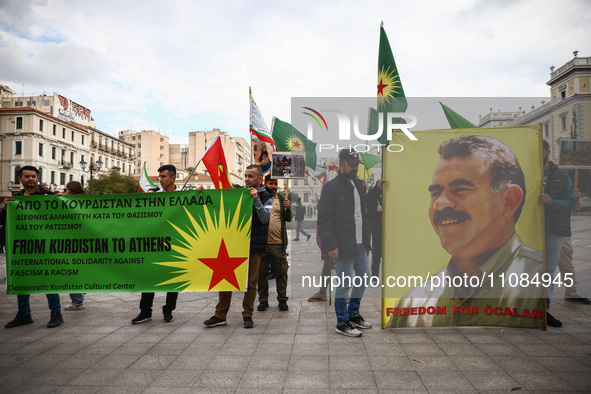 Protestors hold a banner with a picture of Abdullah Ocalan during anti-racist rally in Athens, Greece on March 16th, 2024. A few days before...