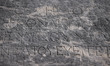 Greek writing on a stone tablet at the Athenian Acropolis in Athens, Greece on March 14th,...