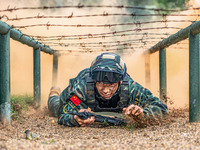 A newly joined SWAT team member is training at the 2024 SWAT team members induction ceremony in Nanning, Guangxi Province, China, on March 2...
