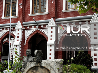 Sculptures are standing outside the Kerala College of Fine Arts building in Thiruvananthapuram, Kerala, India. (