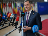 Belgium's Prime Minister Alexander De Croo is speaking to the press as he arrives to attend the European Council Summit in Brussels, Belgium...