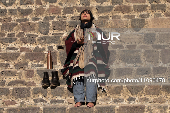 A woman is meditating during the spring equinox in the archaeological zone of Teotihuacan in the Municipality of Teotihuacan, in the State o...