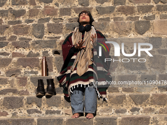 A woman is meditating during the spring equinox in the archaeological zone of Teotihuacan in the Municipality of Teotihuacan, in the State o...