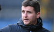Alex Bruce, the assistant manager of Salford City, is watching the Sky Bet League 2 match...