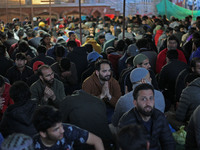 People are gathering to break their fast outside Bilal Masjid, located in the heart of Srinagar, Kashmir, India, on March 23, 2024. A member...