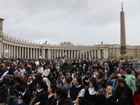 Devotees before the Palm Sunday mass at Saint Peter's Square in Vatican on March 24, 2024. (