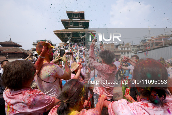 Foreign nationals are dancing to the beats of traditional Nepali musical instruments as they participate in celebrating Holi, the festival o...