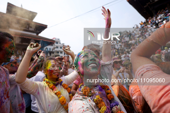 Foreign nationals are dancing to the beats of traditional Nepali musical instruments as they participate in celebrating Holi, the festival o...