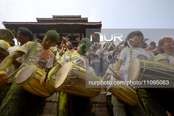Members of a local band are playing traditional musical instruments, entertaining the crowd during the mass celebration of the festival of H...