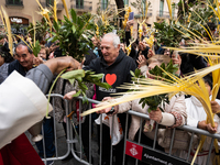 The Christian community in Barcelona, Spain, is blessing the palm during Palm Sunday and participating in the subsequent La Burrita processi...