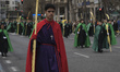 A young man is participating in the Palm Sunday Procession with his bouquet as part of the...