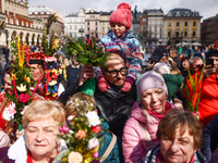 People attend traditional Palm Sunday celebration at the Main Square in Krakow, Poland on March 24, 2024. During Palm Sunday, which is also...