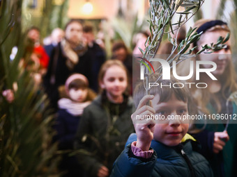 Children attend traditional Palm Sunday celebration at St. Francis' Basilica in Krakow, Poland on March 24, 2024. During Palm Sunday, which...