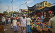 People are buying their daily needs at a marketplace during the fasting month of Ramadan i...