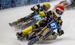 Heikki Huusko of Finland, wearing red and bearing the number 67, is leading Stefan Svensso...
