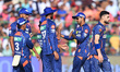 Lucknow Super Giants' players are celebrating a wicket of a Rajasthan Royals batsman durin...