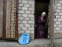 A resident is standing in the frontline village of Prymorske in Zaporizhzhia, south-eastern Ukraine, on March 20, 2024. (