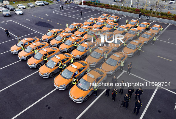New energy taxis are being put into operation in Yichang, Hubei Province, China, on March 26, 2024. 