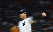 Clayton Andrews #74 of the New York Yankees is pitching a ball against Diablos Rojos del M...